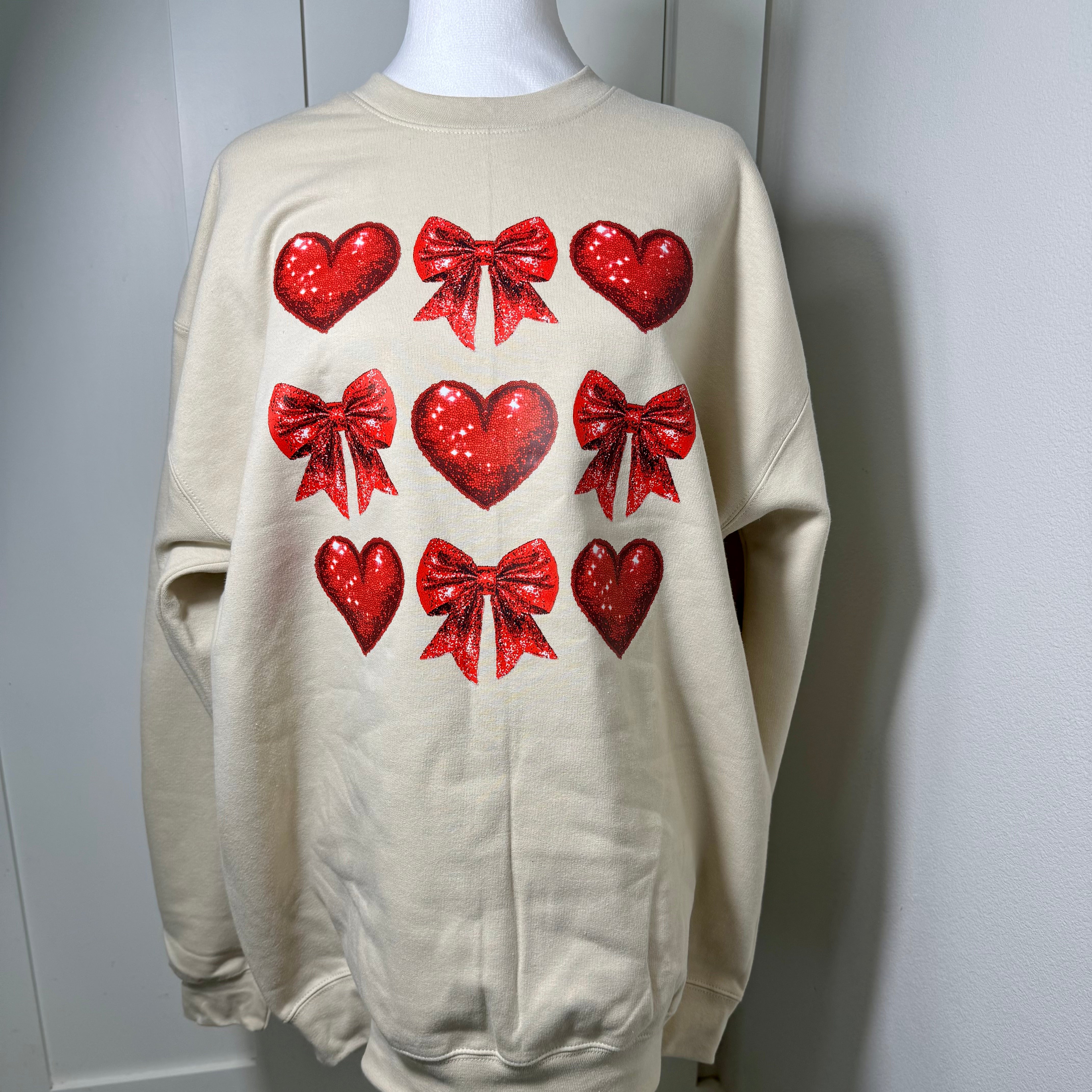 BOWS AND HEARTS GLITTER SWEATER